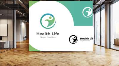 happy human health life logo icon design. people health center vector logo illustration symbol Wall mural