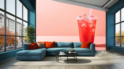 Red drink in a plastic cup isolated on a red pastel background. Take away drinks concept with copy space Wall mural