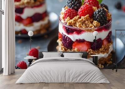 Delicious layered dessert with fresh berries, cream and granola Wall mural