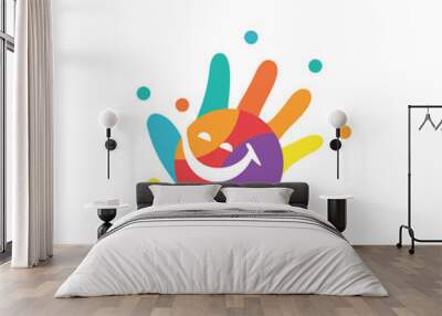 Child hand logo design with cheerful colors Wall mural