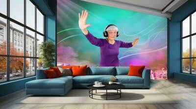 cheerful elderly woman plays music on a DJ console. A disco party in a nightclub for young and overweight people. Age of health, leisure, entertainment in retirement Wall mural