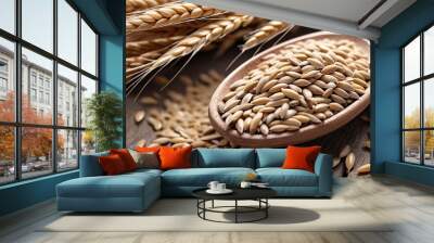 Close-up of golden wheat kernels in wooden spoon. Wall mural