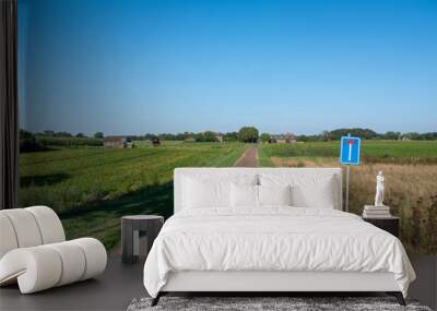 dead end country road with field and farm in national park maasduinen Wall mural