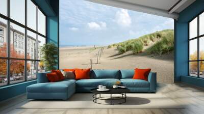 dunes with marram grass and north sea beach in the netherlands Wall mural