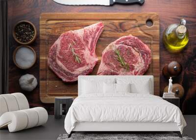 fresh ribeye steak on wooden cutting board Wall mural