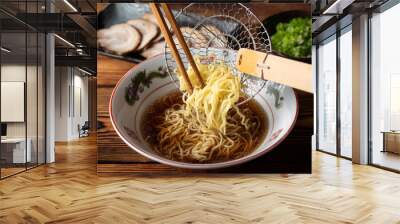 putting japanese ramen noodle in soy sauce chicken  broth Wall mural