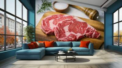 raw ribeye steak beef on white marble background Wall mural