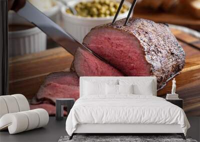 slicing eye of round roasted beef with knife Wall mural