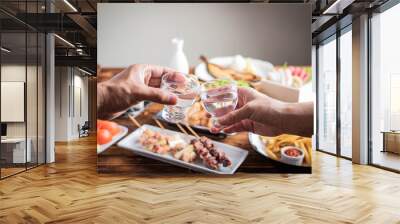 toasting with japanese sake and izakaya popular plates Wall mural