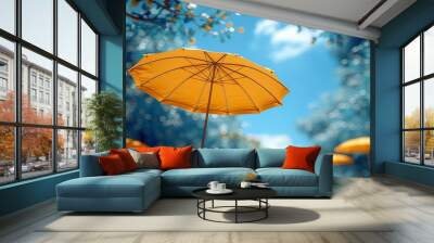 Colorful beach umbrellas against a blue summer sky  Wall mural