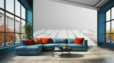 Empty wooden white table over white wall background Wall mural