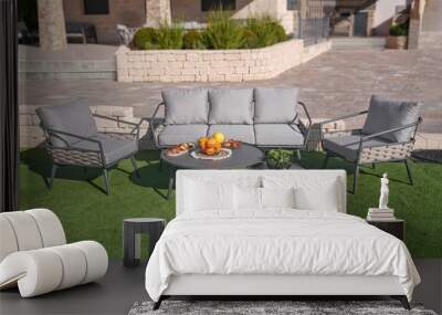 Grey sofa trendy sofa and 2 metal table in the green garden	 Wall mural