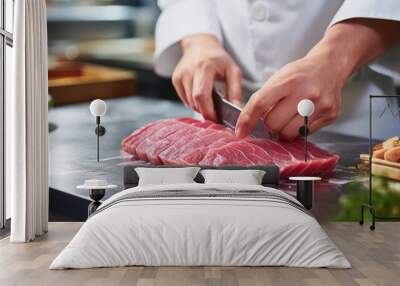 Cutting meat using a knife on the table using both hands. Wall mural