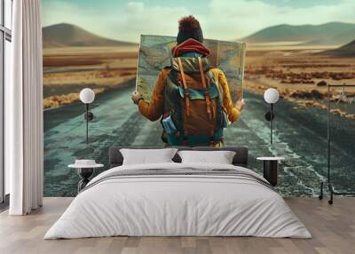 a backpacker holding map in the straight way Wall mural