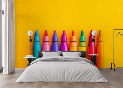 Colorful Markers Arranged in Line on Yellow Background Wall mural