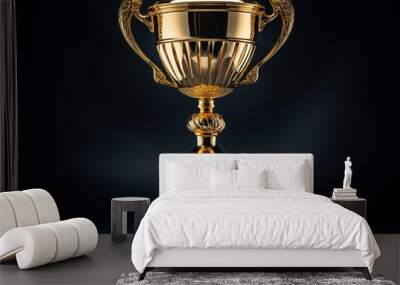 Champion golden trophy isolated on black background. Concept of success and achievement Wall mural