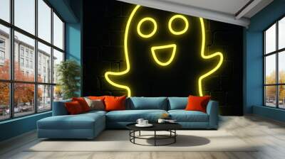 Halloween yellow neon ghost sign glowing on black brick wall for spooky holiday decoration and haunted atmosphere Wall mural