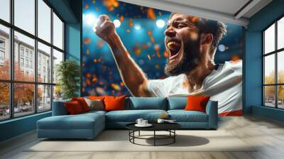 Male soccer player running with joy after scoring a goal Wall mural