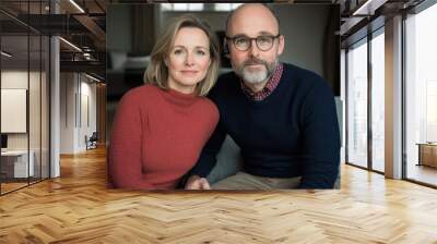 A cozy portrait of a couple sitting together in a modern living room, showcasing love and connection. Wall mural