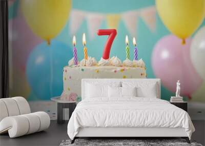 number 7 candle on a seventh year birthday cake celebration with balloons and party decoration as banner  Wall mural