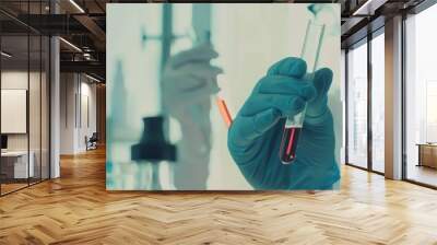 A gloved scientist examines a test tube with a red liquid in a busy laboratory, reflecting a scene of scientific research and analysis. Wall mural