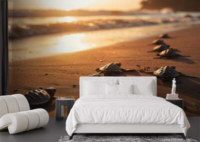 A group of baby turtles crawl towards the ocean waves at sunrise, symbolizing new beginnings and resilience. Wall mural