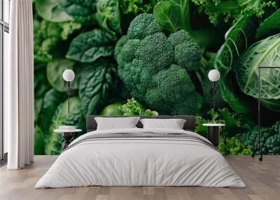 A vibrant composition of fresh green vegetables, including broccoli, spinach, and kale, showcasing their lush textures and natural beauty in a close-up view. Wall mural