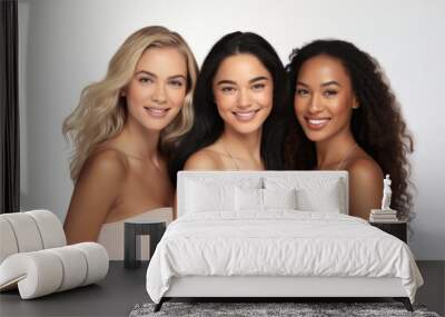 Three young multiracial women smiling together, isolated on white background Wall mural