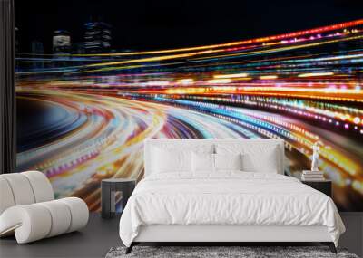 City Lights Speed: Abstract motion blur of city lights at night, colorful streaks of light painting dynamic curves on a roadway, suggesting speed, energy, and the vibrant pulse of urban life. Wall mural