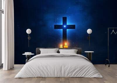 Cross Silhouette Under a Starry Night: A wooden cross silhouetted against a deep blue starry sky, illuminated by the soft glow of two candles in the foreground, evoking a sense of peace and reverence. Wall mural