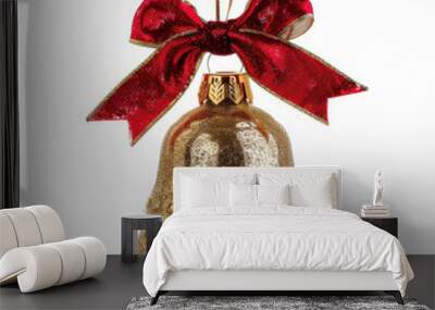 A glimmering gold Christmas bell with a festive red bow, isolated on white background. Wall mural