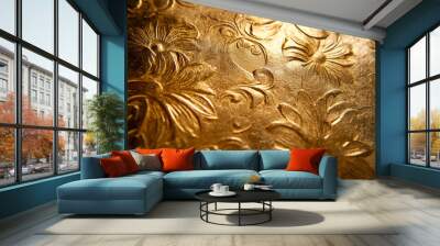 A gold textured surface with intricate, engraved designs, creating an ornate, three-dimensional effect that enhances the metalâ€™s richness. Wall mural