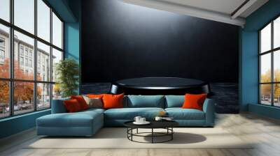 A sleek, black podium with a glossy, reflective surface, set against a dark background with soft, subtle lighting to create a dramatic effect. Wall mural