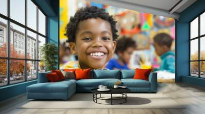 A young Afro-American boy exudes happiness as he engages in an art and creativity class, his smile reflecting the pleasure of creating something new. Wall mural