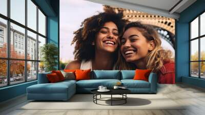 Beautiful gorgeous women in front of the Eiffel tower in Paris Wall mural