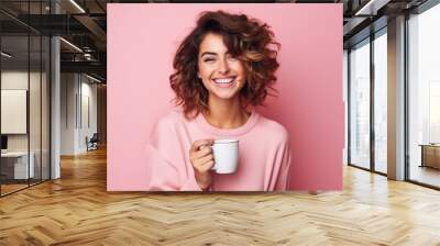 Happy woman with cup of coffee on pink background Wall mural