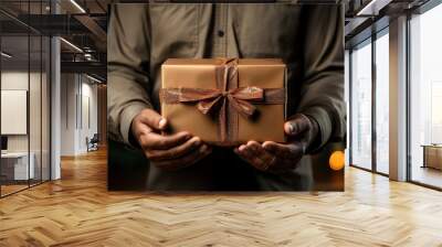 Man hands holding gift cardboard box Wall mural