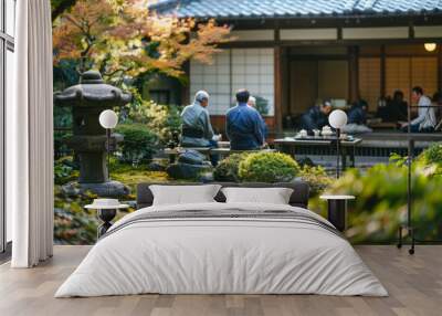 a traditional tea ceremony with participants in a serene garden Wall mural