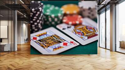 Two playing cards, King of Diamonds and Ace of Spades, with poker chips on a green felt table. Wall mural