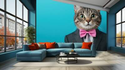 Cat Dressed in Suit with Pink Ribbon Against Blue Background Wall mural