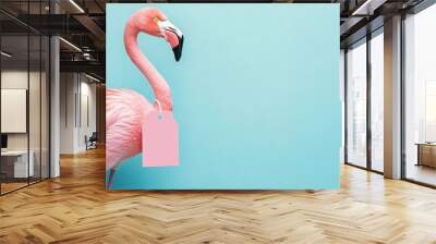 Elegant Flamingo with Discount Tag on Soft Blue Background Wall mural