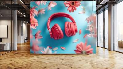 Red headphones and flowers floating against a blue backdrop Spring inspired creative arrangement showcasing music and floral elements Wall mural