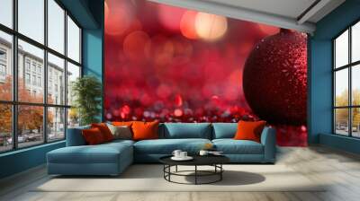 A festive and vibrant photograph capturing a single sparkling red Christmas ornament set against a blurred background of bokeh lights, evoking the warmth and joy of holiday celebrations Wall mural