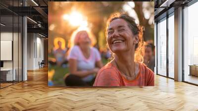 A Vibrant Gathering of Joyful Individuals of Various Sizes Participating in a Laughter Yoga Session in a Sunlit Park Wall mural