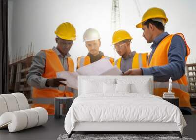 Group of construction workers wearing safety vests and helmets, having a break and discussing project plans, generative ai Wall mural