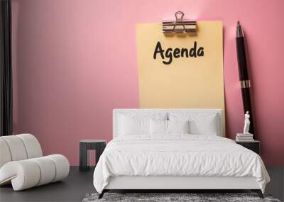 agenda meeting schedule on clipboard with pen isolated on light pink background with copy space for text Wall mural