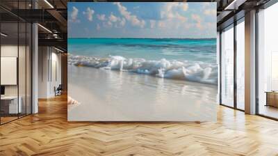 Beautiful summer background with a seashell on a sandy beach and blue sea on a sunny day. Holiday concept. Wall mural