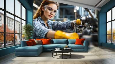 Confident Female Worker Operating Machinery in a Modern Industry Setting Wall mural