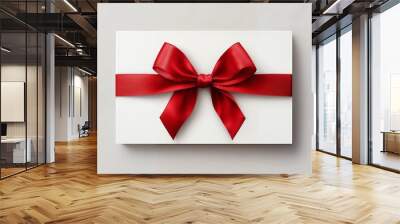 A white gift box with a red ribbon and bow for special occasions Wall mural