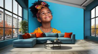 African Cloth. Happy Black Girl Thinking, Imagining, and Smiling for Future Vacation Wall mural